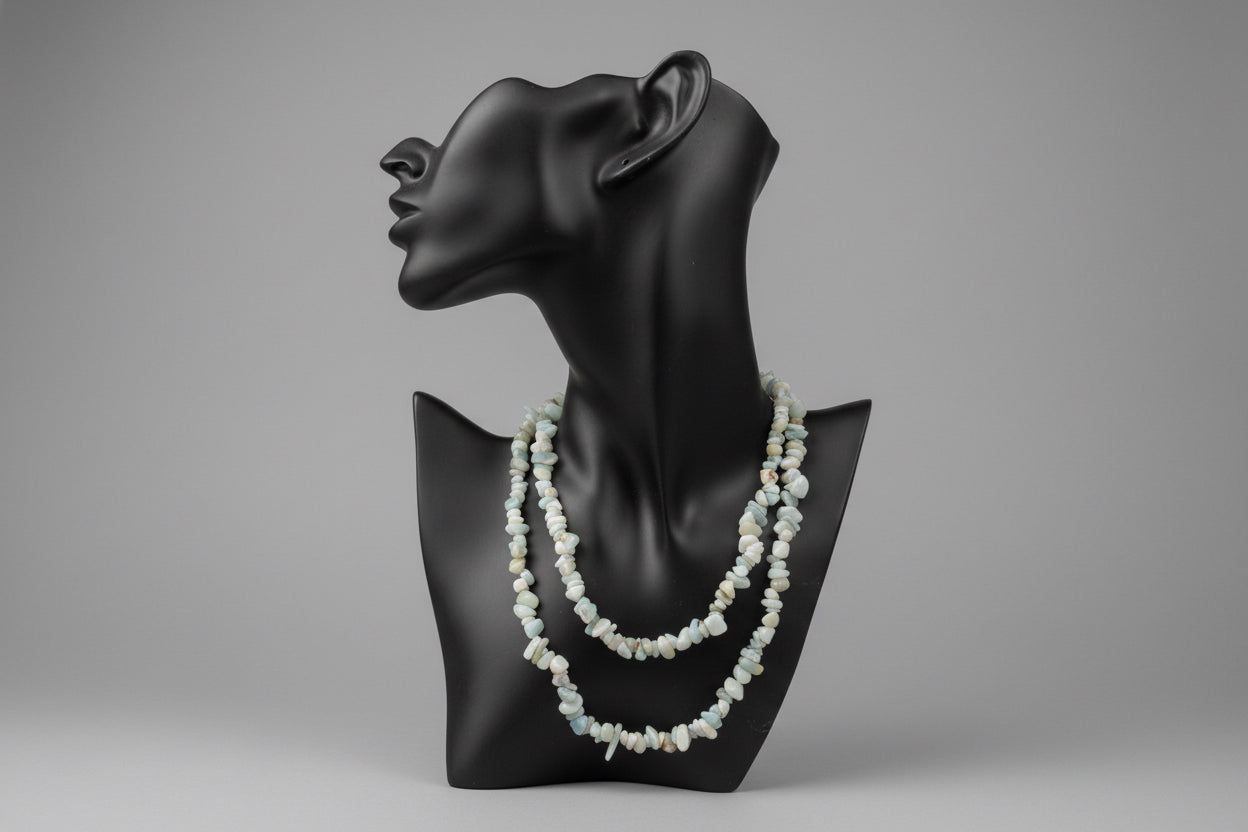 Amazonite_Chip_Necklace on a black neck shaped stand with a gray background
