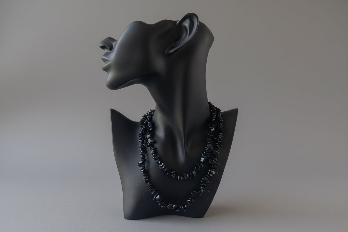 Black necklace display with a Blue_Goldstone_Necklace_30-32_Inches on a mannequin head against a gray background