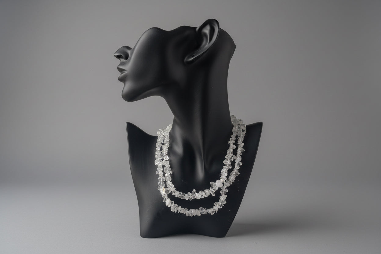 Clear_Quartz_Necklace_30-32_Inches on a black mannequin display with a blurred background