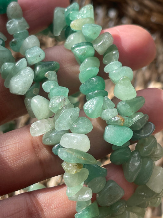 Green Aventurine Chip Necklace from pure energy crystals on fingers