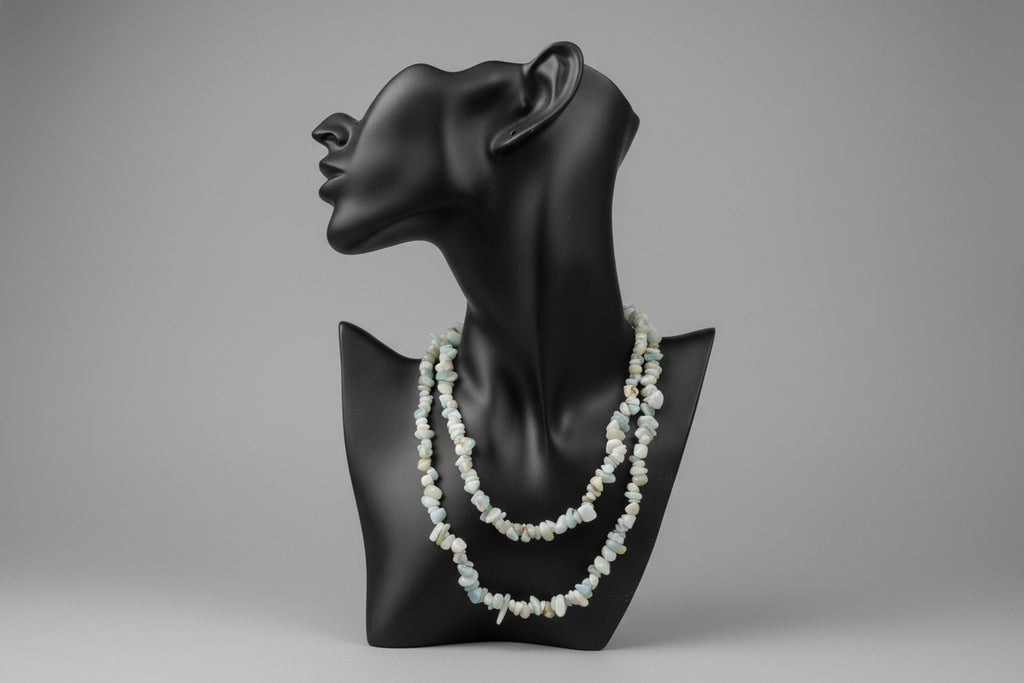 Amazonite_Chip_Necklace on a black neck shaped stand with a gray background