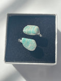 Silver plated Amazonite Ring with turquoise stones on a dark blue cushioned box.