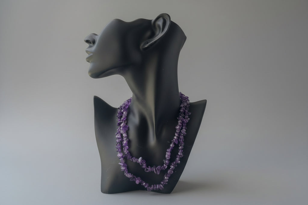 Amethyst_HQ_Necklace on Black mannequin head with purple gemstone necklace against a neutral background