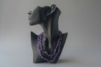Amethyst_HQ_Necklace on Black mannequin head with purple gemstone necklace against a neutral background