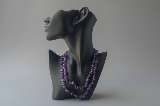 Amethyst_HQ_Necklace on Black mannequin head with purple gemstone necklace against a neutral background