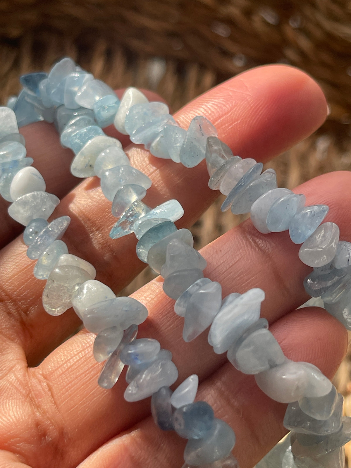 Aquamarine Chip Necklace from pure energy crystals On fingers 