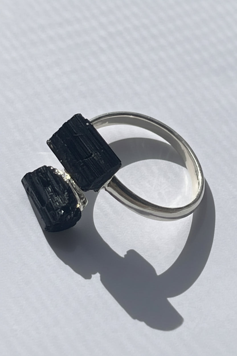 Black Adjustable silver  plated Tourmaline Ring at Pure Energy Crystals In Florida On table 