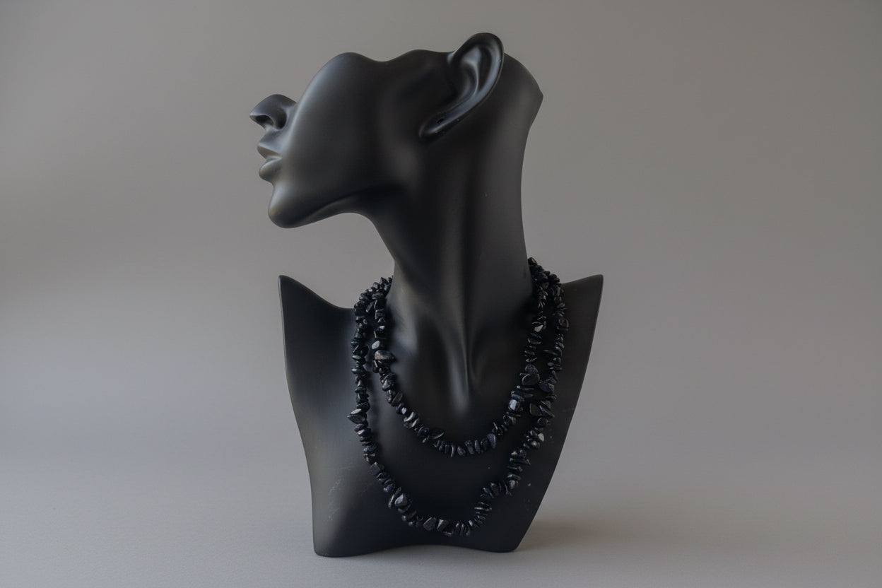 Black necklace display with a Blue_Goldstone_Necklace_30-32_Inches on a mannequin head against a gray background
