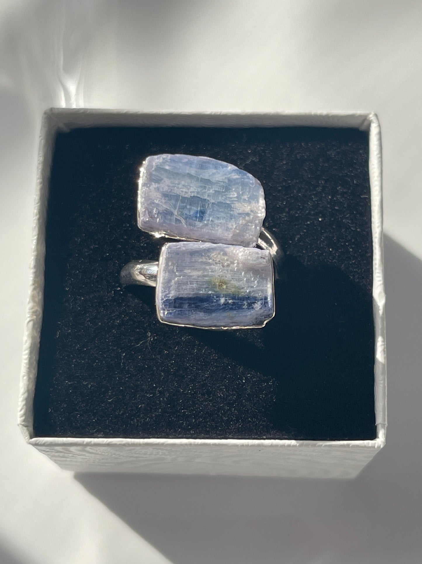Blue Kyanite adjustable silver plated ring in studio 
