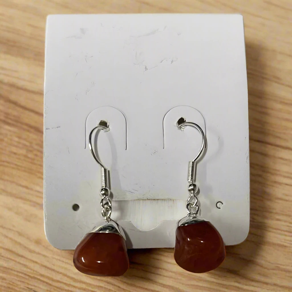 Carnelian earrings, Agate jewelry, Tumbled stone earrings, Silver plated earrings, Handmade gemstone jewelry, Natural crystal earrings, Boho earrings, Healing stone jewelry, Dangle gemstone earrings, Raw crystal earrings, Carnelian crystal, Crystal healing jewelry, Chakra jewelry, Sacral chakra stone, Confidence crystal, Energy boost crystal, Spiritual jewelry, Bohemian style, Gift for her, Nature inspired jewelry, Earthy jewelry, Unique gift idea, Handmade gift, Festival jewelry, Statement earrings