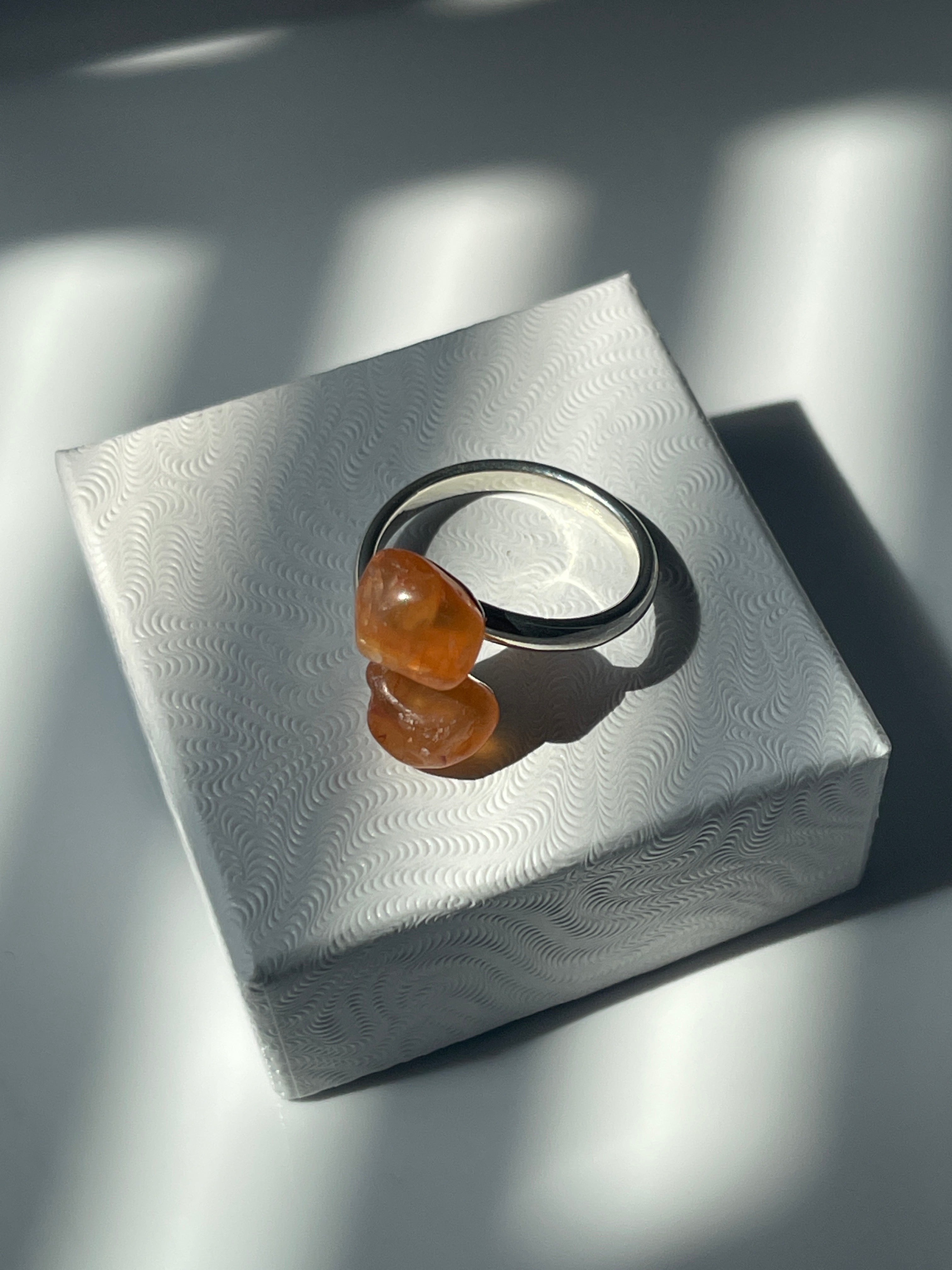 Carnelian Agate Silver Adjustable Ring on a jewelry box top in Florida 