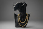 Citrine Chip Necklace on a black mannequin bust with a blurred gray background