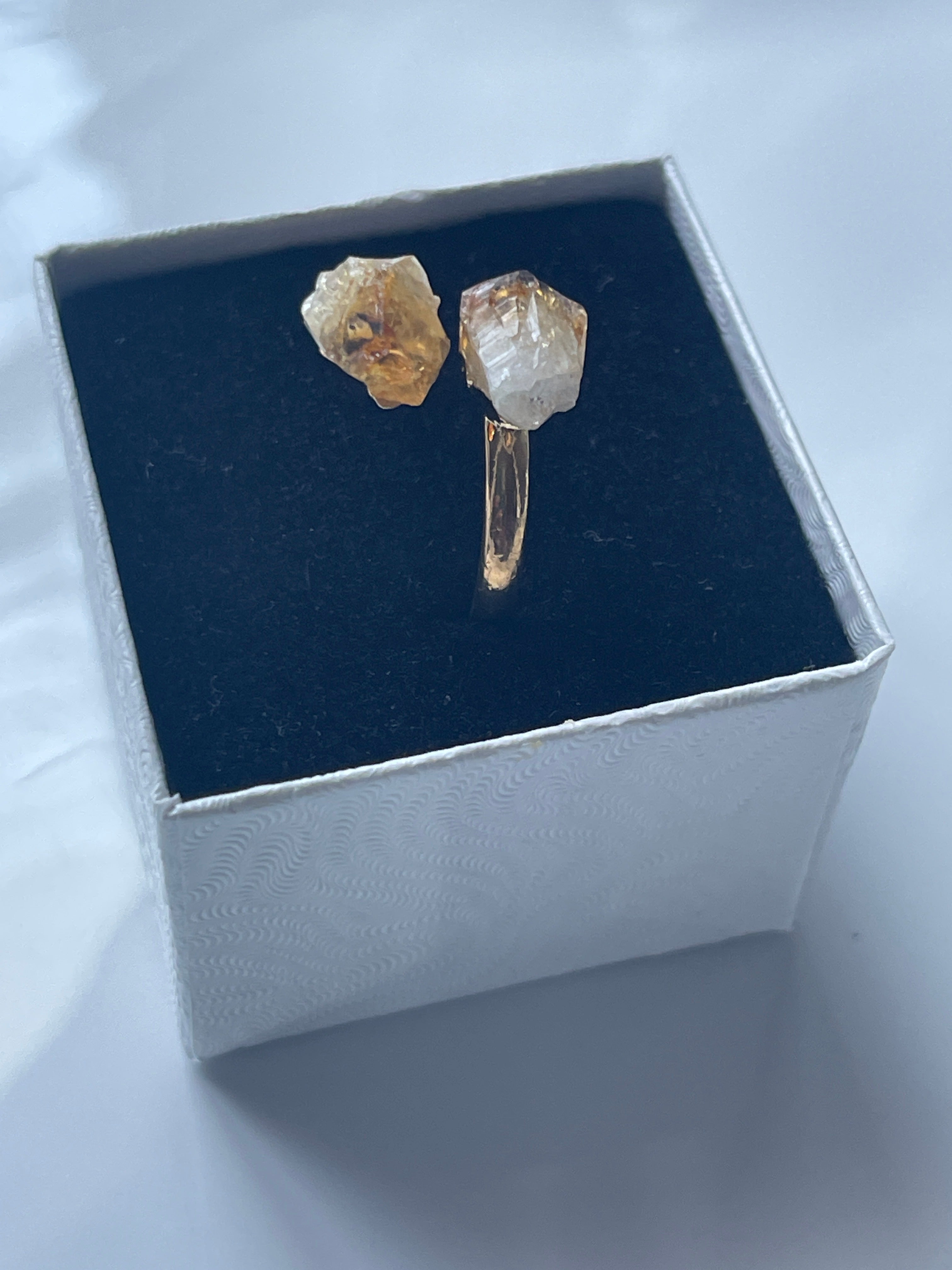 Citrine Natural Adjustable Ring Gold Plated in Florida Inside a black and white jewelry box from a side view 