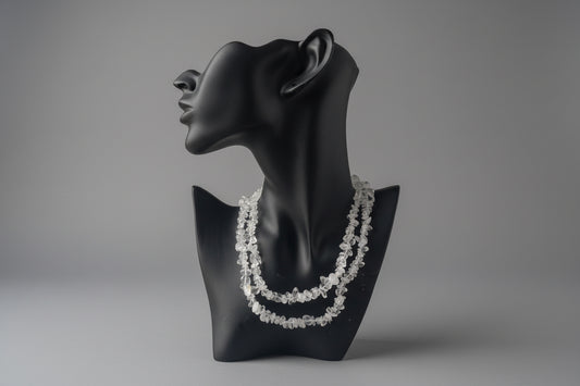 Clear_Quartz_Necklace_30-32_Inches on a black mannequin display with a blurred background