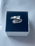 Clear quartz silver plated ring in a jewelry box on a white background 