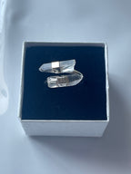 Clear quartz silver plated ring in a jewelry box on a white background 