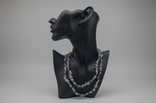 Black mannequin head with Fluorite_Necklace_30-32_Inches in a gray studio 