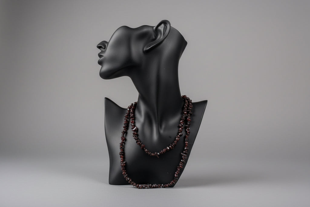 Black jewelry display showcasing Garnet_Necklace_30-32_Inches