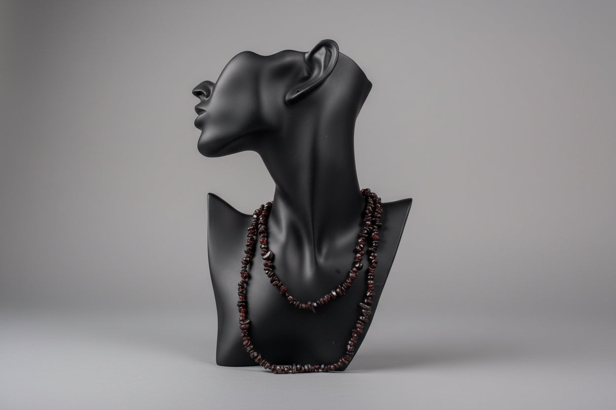 Black jewelry display showcasing Garnet_Necklace_30-32_Inches