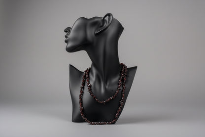 Black jewelry display showcasing Garnet_Necklace_30-32_Inches