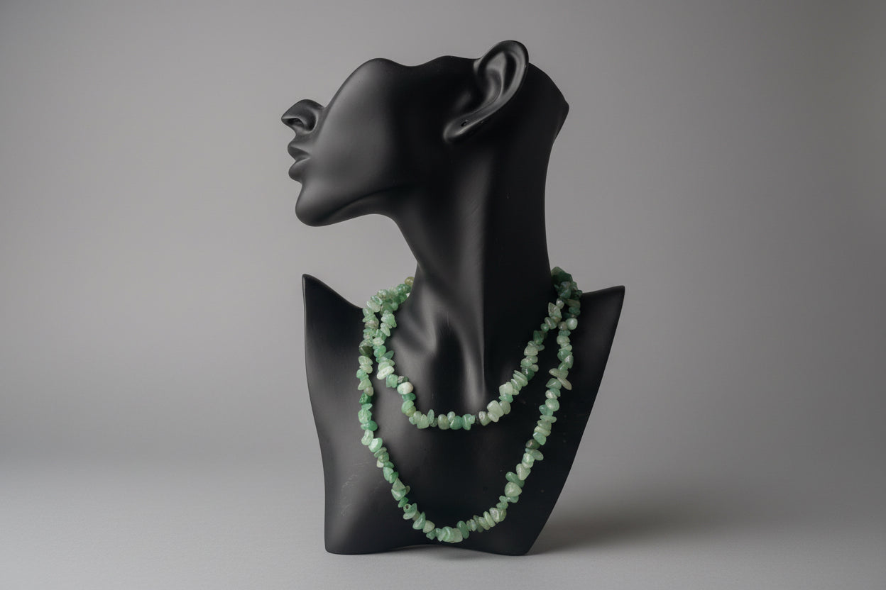 Green Aventurine chip beaded necklace on a black mannequin bust against a neutral background