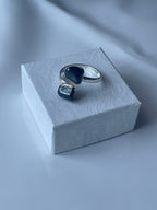 Hematite Adjustable Ring Silver Plated on a jewelry box