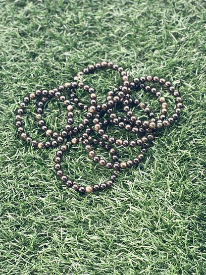 String of beads on grass