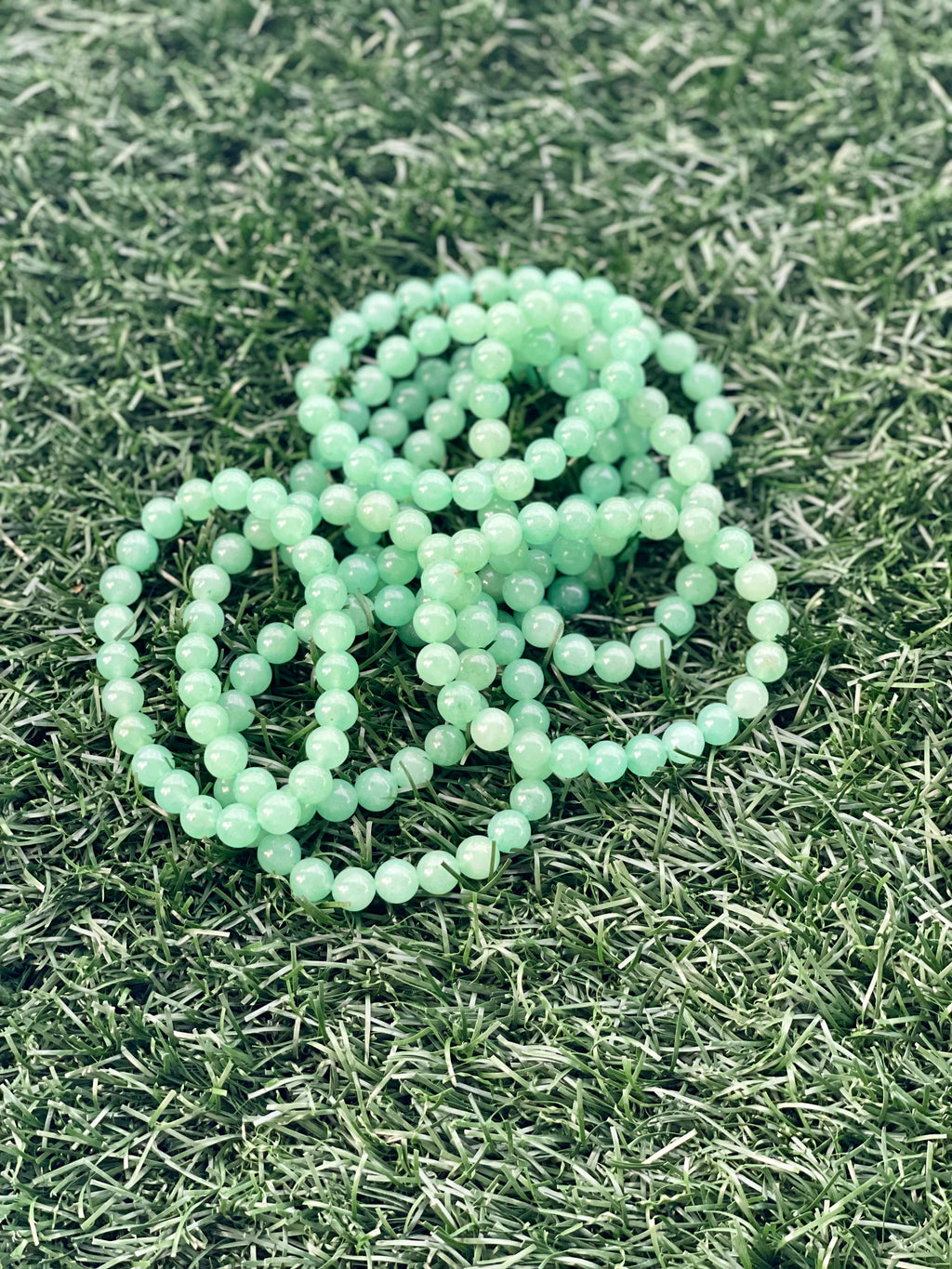 Light green beads on grass