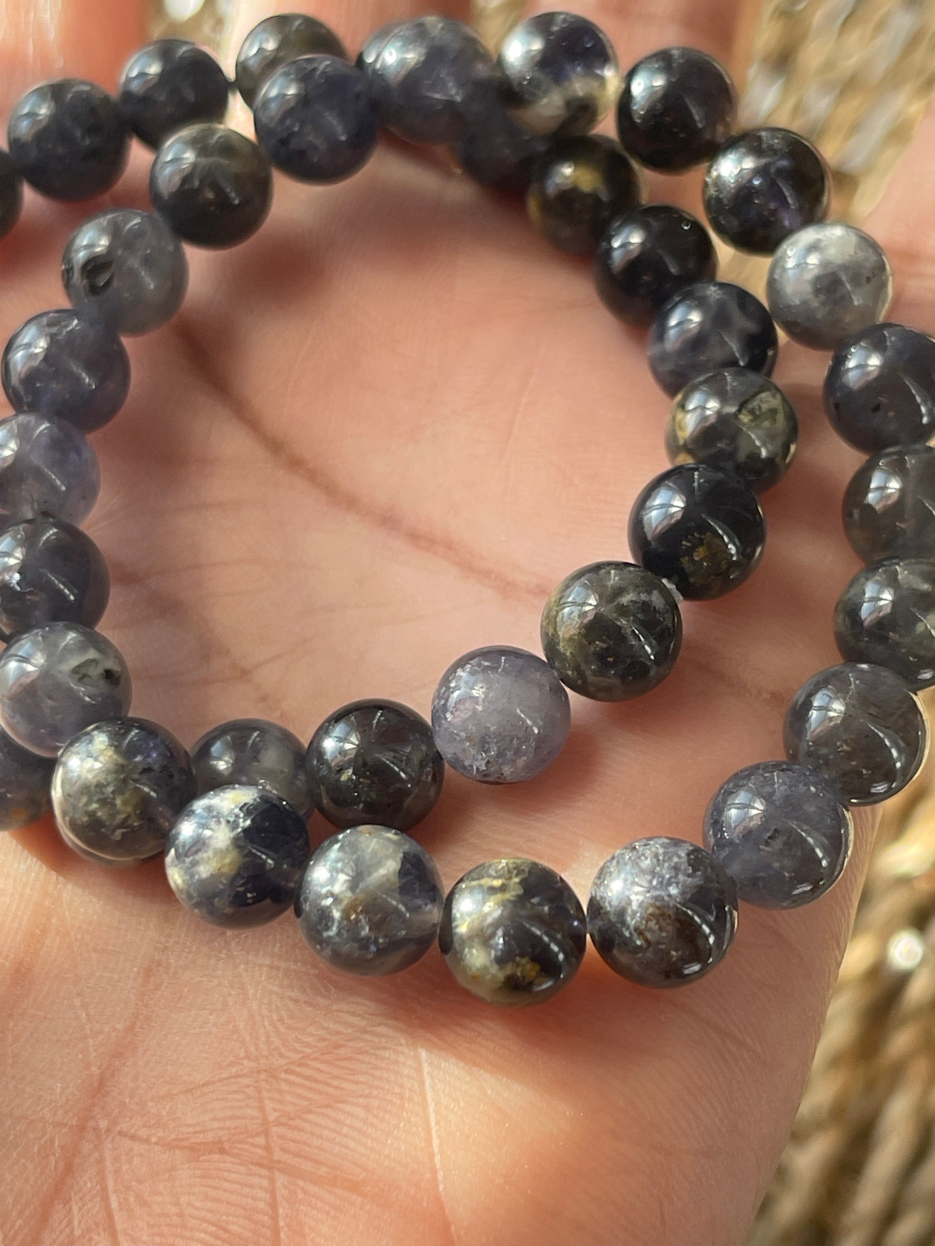 Close-up of a Iolite beaded bracelet on a hand in Florida 
