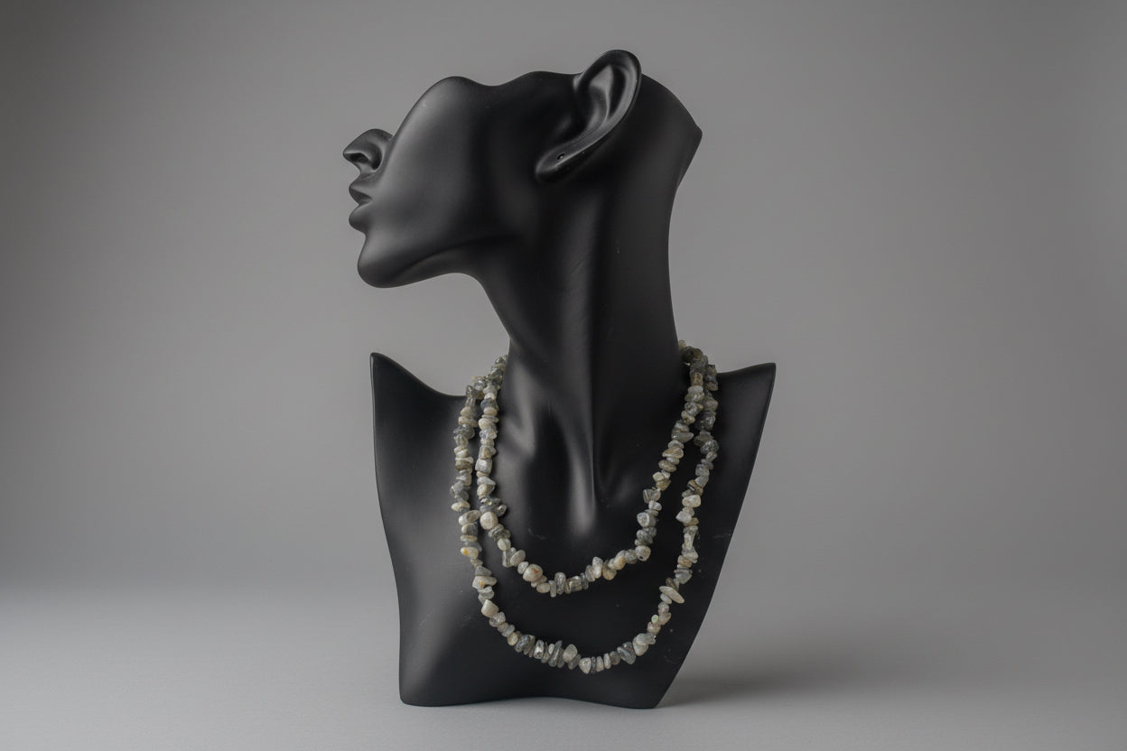 Black mannequin bust with a Labradorite_Chip_Necklace necklace on a gray background