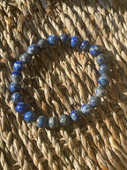 Blue beaded bracelet on a woven basket in Florida at Pure Energy Crystals