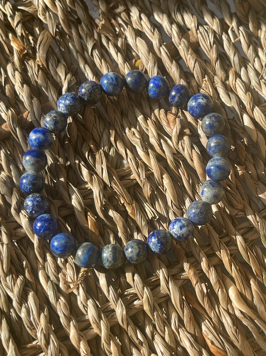 Blue beaded bracelet on a woven basket in Florida at Pure Energy Crystals
