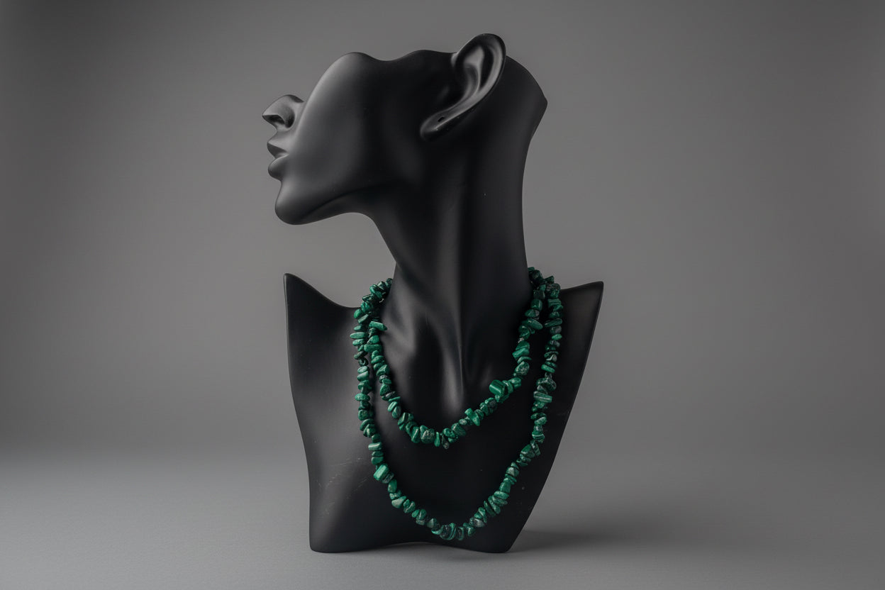 Malachite_Necklace_30-32_Inches on a black mannequin bust against a gray background