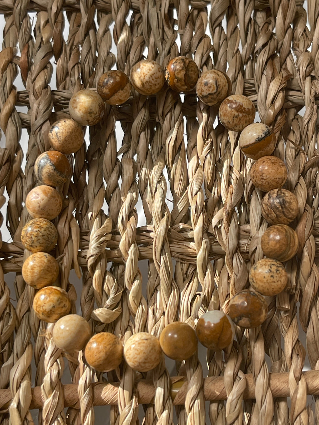 Close-up of picture Jasper bracelet in woven material with wooden beads