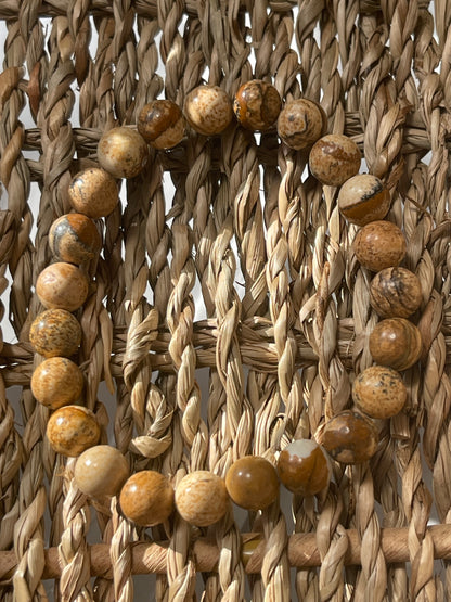 Close-up of picture Jasper bracelet in woven material with wooden beads