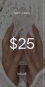 Gift card with $25 value held by a hand against a textured background. Pure Energy Crystals Gift Card $25