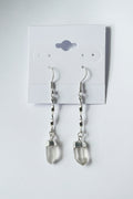 Quartz Crystal Spiral Earrings Silver plated earrings with crystal pendants on a gray card