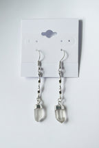 Quartz Crystal Spiral Earrings Silver plated earrings with crystal pendants on a gray card
