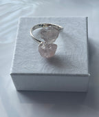 Rose quartz silver plated ring on a textured white jewelry box in Florida 