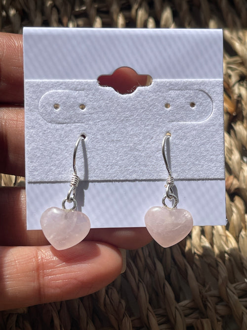 Rose Quartz Polished Heart Earrings At Pure Energy Crystals In Florida in hand 