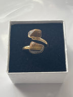 Tigers eye gold plated Ring in a box white jewelry box on a white background in Florida 