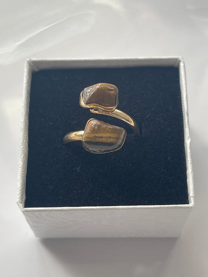 Tigers eye gold plated Ring in a box white jewelry box on a white background in Florida 