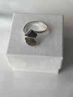 Tigers eye silver plated ring on a textured white jewelry box in Florida 