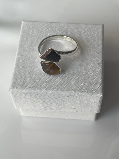 Tigers eye silver plated ring on a textured white jewelry box in Florida 