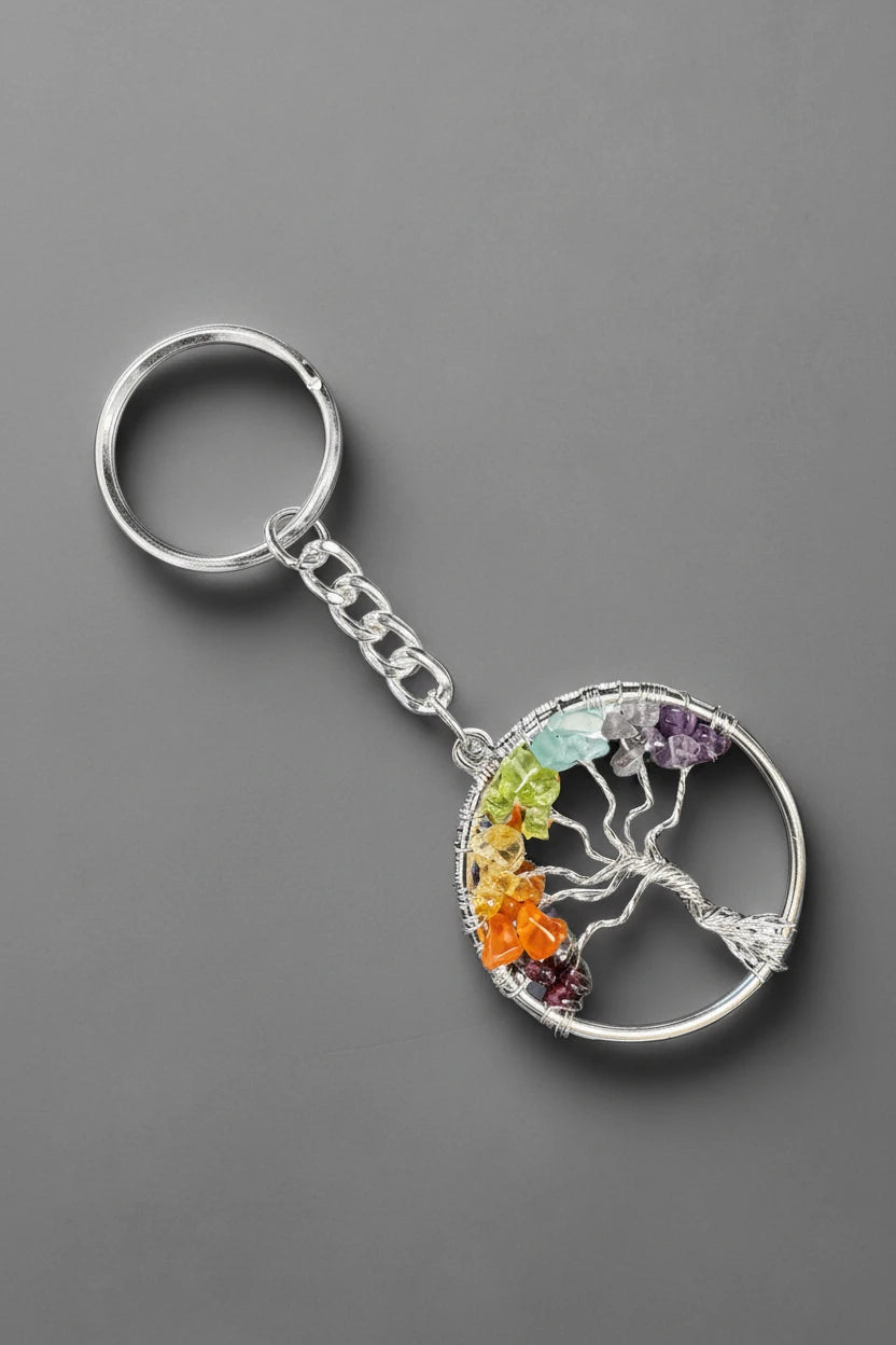 Tree of Life Keychain on a gray studio backdrop.